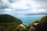 Fototapeta Na ścianę - A beautiful tropical paradise island, Fitzroy Island in Queensland, Australia, with lush green hills and turquoise water, located in the Great Barrier Reef.
