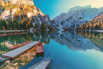 Wall Mural - Boats on the Braies Lake ( Pragser Wildsee ) in Dolomites mountains, Sudtirol, Italy.  Alps nature landscape