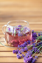 Sticker - Glass cup of lavender tea.