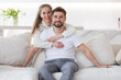 © alotofpeople - Couple relaxing in living room