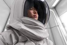 Female Cosmonaut In Futuristic Spacesuit