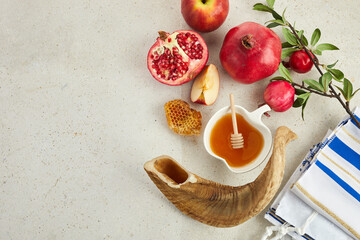 Rosh hashanah, jewish New Year holiday concept. Pomegranate, apples and honey traditional products for celebration