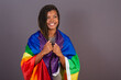 Young Afro Brazilian woman, wearing LGBT, LGBTQ, militancy, bisexual flag. diversity. Lesbian.