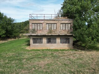 Wall Mural - 
Aerial view of World war two military airfield control tower at Forma RAF Woolfox Lodge Aerodrome. Rutland, England. Royal Air Force Woolfox Lodge or more simply RAF Woolfox Lodge 