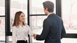 © LIGHTFIELD STUDIOS - happy woman shaking hands with employer after job interview.