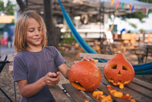 8 Year Old Boy Carving Halloween Pumpkin