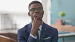 © stockbakers - Pensive Young African Businessman Thinking