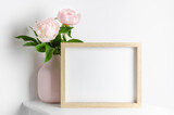 Fototapeta  - Frame mockup with pink peony flowers in vase, mockup for artwork presentation