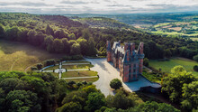 Aerial View Of The Castle Of Trévarez In Brittany, France - Red Brick Neo-gothic Mansion Built On A Hillside In A Beautiful Domain With French Classical Gardens