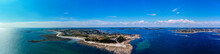 Aerial View Of The Pointe De Kerpenhir At The Entrance Of The Gulf Of Morbihan In Brittany, France - Panoramic View Of The Rocky Peninsula At Low Tide
