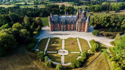 Wall Mural - Aerial view of the Castle of Trévarez in Brittany, France - Red brick neo-gothic mansion built on a hillside in a beautiful domain with French classical gardens