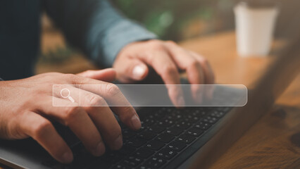 Aufkleber - Searching Browsing Internet Data Information with blank search bar. Search Engine Optimization SEO Networking Concept. hand of businessman working with computer laptop on desk in office...