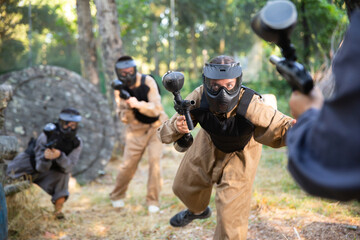 Poster - Attack of the paintball team on the enemy at the army training ground