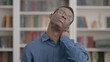 © stockbakers - Young African Man having Neck Pain