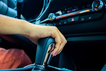 Woman's Hand On Car Gear Shift