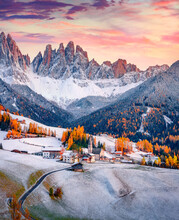 Fresh Snow Covered Green Hills On Santa Magdalena Village. Fantastic Autumn View Of Seceda Peak. Incredible Landscape Of Dolomite Alps, Italy. Traveling Concept Background.