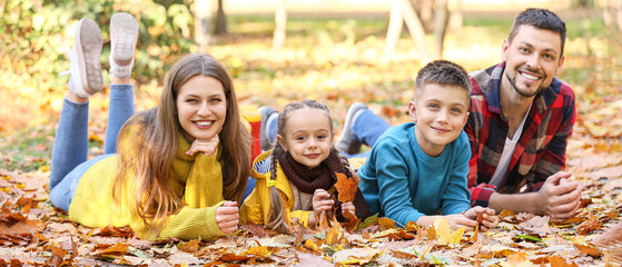 Sticker - Happy young family resting in autumn park