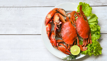 Wall Mural - seafood crab cooking food boiled or steamed crab red in the seafood restaurant, fresh crab on white plate background