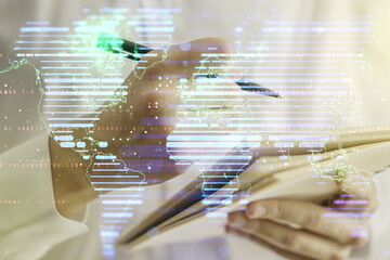 Poster - Multi exposure of abstract creative digital world map and man hand writing in notebook on background, research and analytics concept
