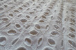 Close view of vintage white eyelet embroidery cotton fabric