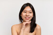 © Prostock-studio - Pretty young korean lady with perfect skin in towel isolated on white background, studio shot