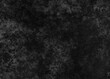 Black monochrome engrave shapes background with random black noise in grey watercolor shadows. Dark grunge noise stipple dots wave. Halloween grain effect. Black dots grunge swoosh smudge shape	

