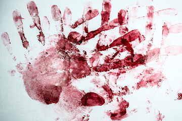 Fototapeta red bloody fingerprints and palm print  on the white background. horror and crime scene concept. halloween postcard.