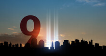 September 11 Tribute In Light Art Installation In The Lower Manhattan New York City Skyline At Sunset. 9.11 Date Concept. American Patriot Day Banner.