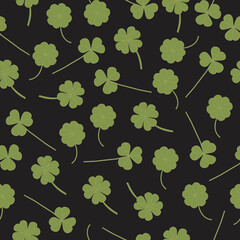 Wall Mural - clover leaves on a black background in fabric pattern