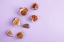 Ripe Whole And Cut Blue Figs With Lavender On The Purple Background.Top View. Copy Space.