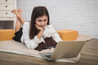 © skarie - Successful entrepreneur business woman accepts orders from customer via online sales in her home office, prepare parcel box of product for deliver to customer.