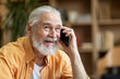© Prostock-studio - Emotional old man having phone conversation, looking at copy space