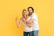 © Prostock-studio - Cheerful funny millennial caucasian woman and man in white t-shirts have fun, show peace sign with hands