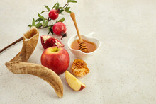 Rosh Hashanah, Jewish New Year Holiday Concept. Pomegranate, Apples And Honey Traditional Products For Celebration