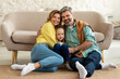 © Prostock-studio - Happy Parents And Kid Daughter Hugging Posing At Home