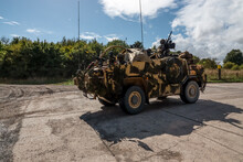 Army Reconnaissance Vehicle In Action On A Military Exercise