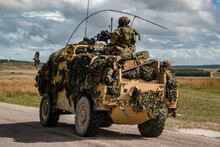 Army Recon Vehicle In Action On An Exercise
