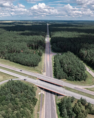 Multi-lane highway bridges over road in the countryside