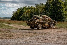 British Army Supacat Jackal Rapid Assault, Fire Support And Reconnaissance Vehicle In Action On A Military Exercise