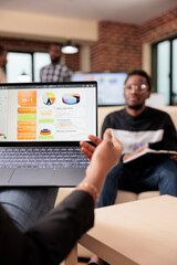 Poster - african american people analyzing business charts and diagrams on laptop to create startup presentat