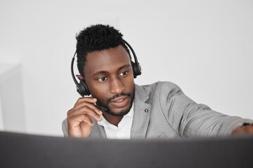 Aufkleber - Call center, customer service and crm representative wearing headset while consulting with customer in telemarketing company. Serious black man in contact us and sales support working on a computer