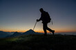 © pierluigipalazzi - Early morning hiker walking with flashlight on head