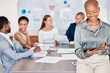 © M Einero/peopleimages.com - Business woman working on digital tablet while in team meeting analyzing documents and paperwork. Diversity, corporate and professional group of people doing research and planning a project in office