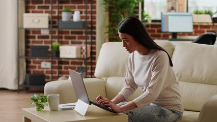Poster - Hurried woman working remotely on laptop while developing startup project because of early deadline. Beautiful freelancer doing remote work on modern computer while developing business ideas at home.