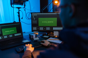 Poster - cybercrime, hacking and technology concept - close up of male hacker in dark room writing code or using computer virus program for cyber attack