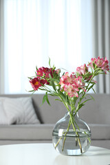 Canvas Print - Vase with beautiful alstroemeria flowers on table in living room, space for text. Stylish element of interior design