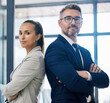 © Malik E/peopleimages.com - Partnership, arms crossed and teamwork with two business people standing together in corporate office building. Success, motivation and vision with employees in innovation or management company