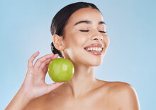 Health, Skincare And Beauty Woman With An Apple For Wellness, Healthy And Organic Lifestyle In Studio. Girl With Clear, Fresh And Natural Skin Holding A Fruit With Vitamins And Nutrition For A Diet