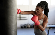 Boxer, Workout And Training Girl With Punching Bag Working On Sports Fitness, Exercise And Strength. Athlete, Fighter Or Black Woman In A Boxing, Health And Wellness Gym Or Martial Arts Fight Club