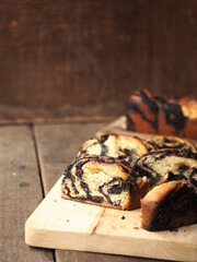 Wall Mural - sliced chocolate babka brioche on wooden board